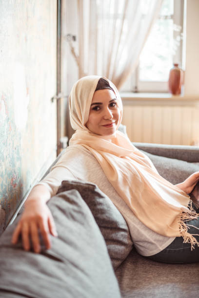 istock arab woman at home with tablet 1216980780
