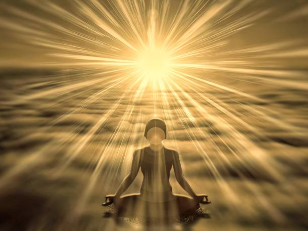 Person meditating in the morning sun