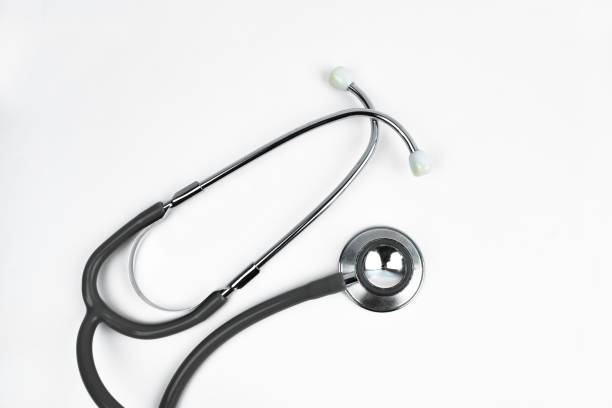 A medical users stethoscope nicely placed over an empty white isolated background