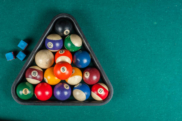 istock Billiards balls and cue on billiards table. Billiard sport concept. 1216983956