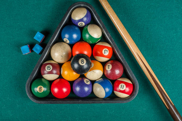 istock Billiards balls and cue on billiards table. Billiard sport concept. 1216983969