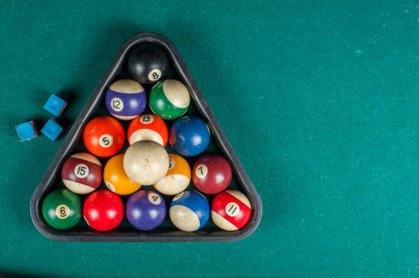 istock Billiards balls and cue on billiards table. Billiard sport concept. 1216984015