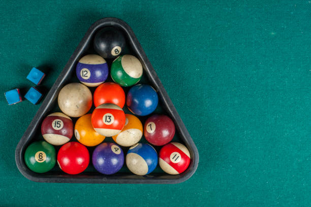 istock Billiards balls and cue on billiards table. Billiard sport concept. 1216984059