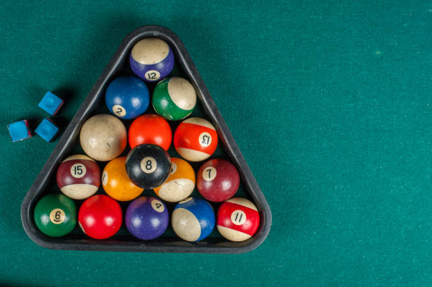 istock Billiards balls and cue on billiards table. Billiard sport concept. 1216984065