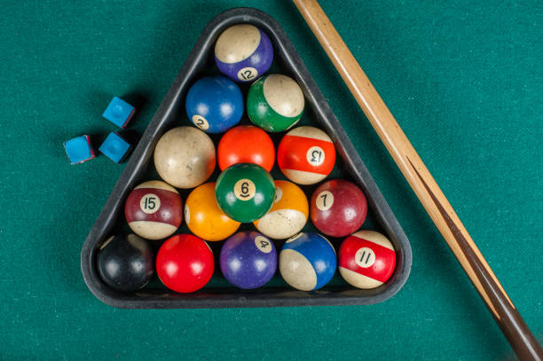 istock Billiards balls and cue on billiards table. Billiard sport concept. 1216984120