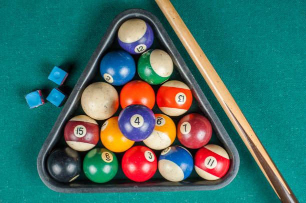 istock Billiards balls and cue on billiards table. Billiard sport concept. 1216984197