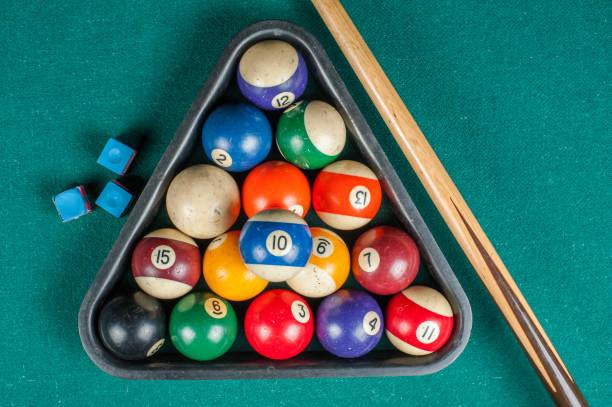 istock Billiards balls and cue on billiards table. Billiard sport concept. 1216984201