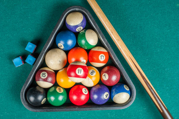 istock Billiards balls and cue on billiards table. Billiard sport concept. 1216984316