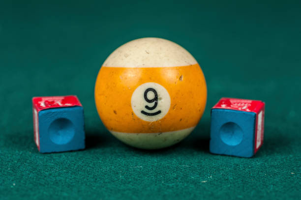 istock Billiards balls and cue on billiards table. Billiard sport concept. 1216984808