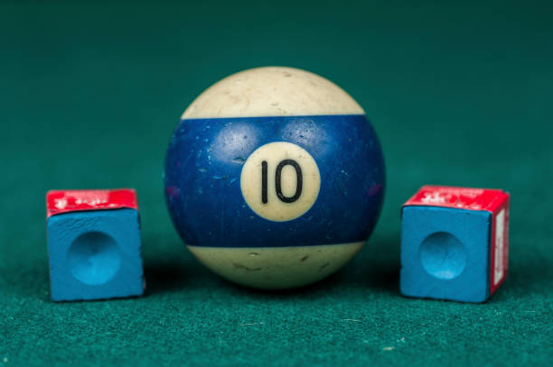 istock Billiards balls and cue on billiards table. Billiard sport concept. 1216984873