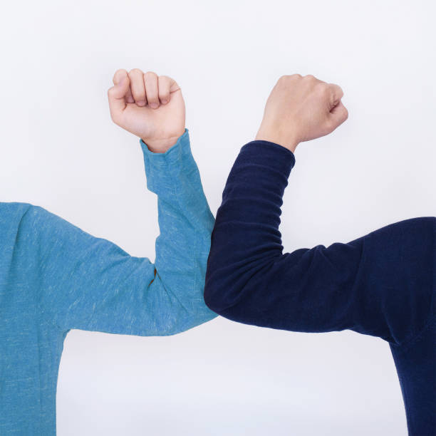 istock Elbow bump - a new and safe way of greeting 1216984910