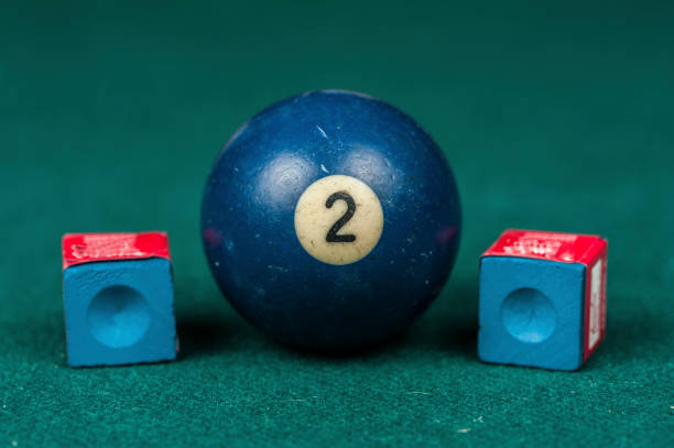 istock Billiards balls and cue on billiards table. Billiard sport concept. 1216984914