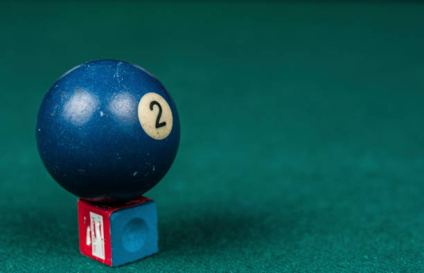 istock Billiards balls and cue on billiards table. Billiard sport concept. 1216985456
