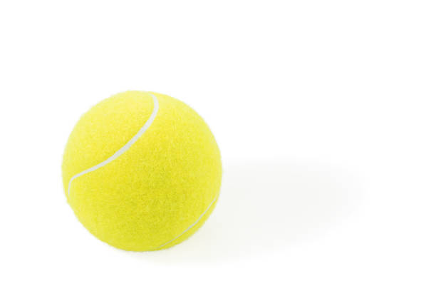 istock yellow tennis ball on white 1216985572