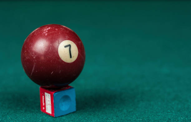 istock Billiards balls and cue on billiards table. Billiard sport concept. 1216985599