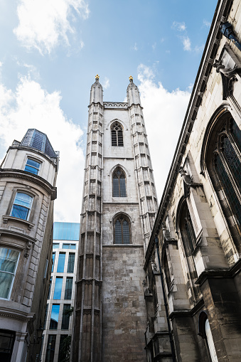 Low-angle view of the tower of St Mary Aldermary, an Anglican church in Watling Street in the City of London.
