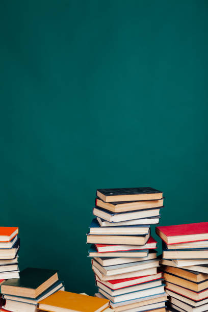 istock many stacks of educational books for learning preparation for college exams on a green background 1216987021