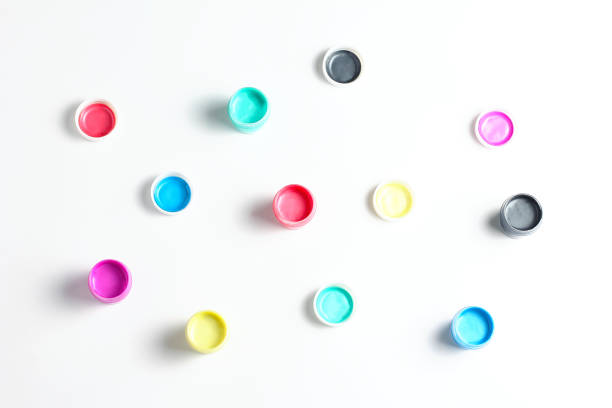 istock acrylic paint in cans on a white background. flat lay 1216987036