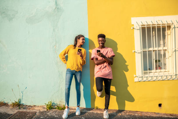 istock Smiling young couple using mobile phone. 1216990222
