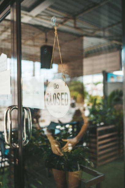 istock Store Owner in medical mask closed restaurant for quarantine 1216991350