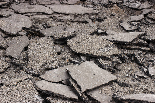 istock Pieces of Broken asphalt. Dismantling road surface 1216991832