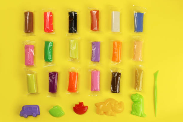 istock colorful clay, plasticine with tools on a yellow background 1216991909