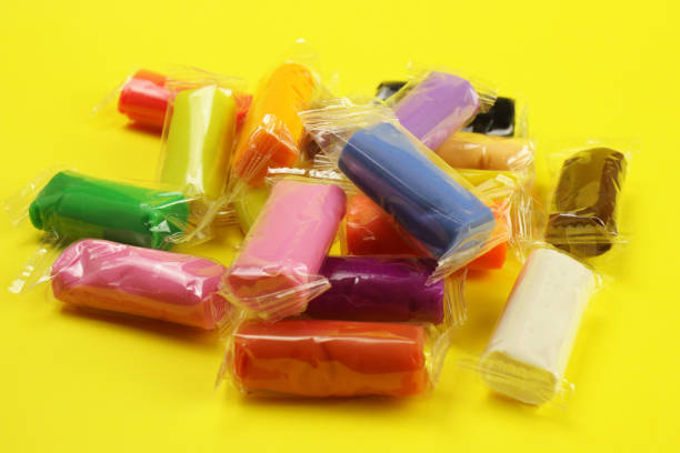 istock colorful clay, plasticine on a yellow background 1216991950
