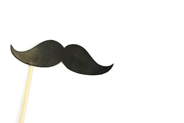 istock Black mustache on a stick isolated on a white background. Photo booth . Space for text 1216992039