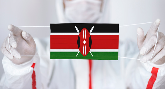 Healthcare personnel is holding Kenyan Flag shaped surgical mask.