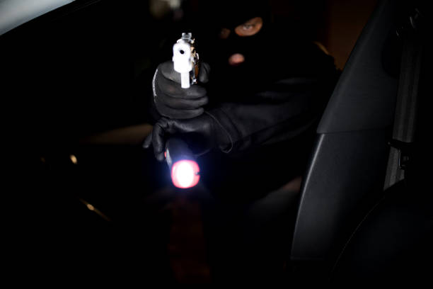 istock Violence and theft in the Coronavirus era. Man stealing a car 1216993561