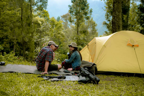 friends happy and enjoy camping at the rain forest - travel ipad isolated backpack imagens e fotografias de stock