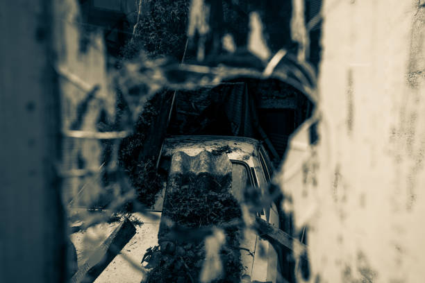 istock Old decaying car abandoned inside Cholet city 1216994900