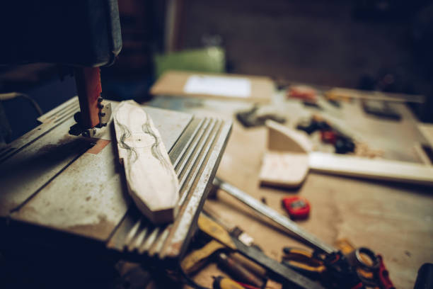 istock Carpenters working desk with airplane model 1216994920