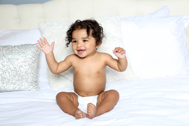 istock Baby girl in diaper 1216994966