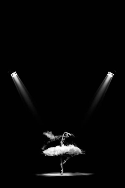 istock Ballerina dancing with dust under the spots 1216994986