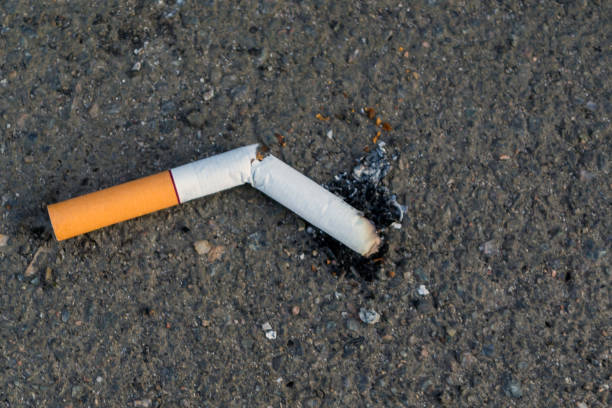 istock The cigarette lies on asphalt 1216995180