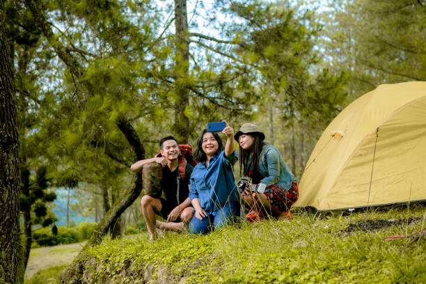 istock friends happy and enjoy camping at the rain forest 1216995317