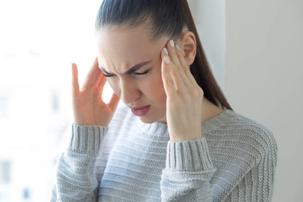 istock Young woman in headache 1216996778