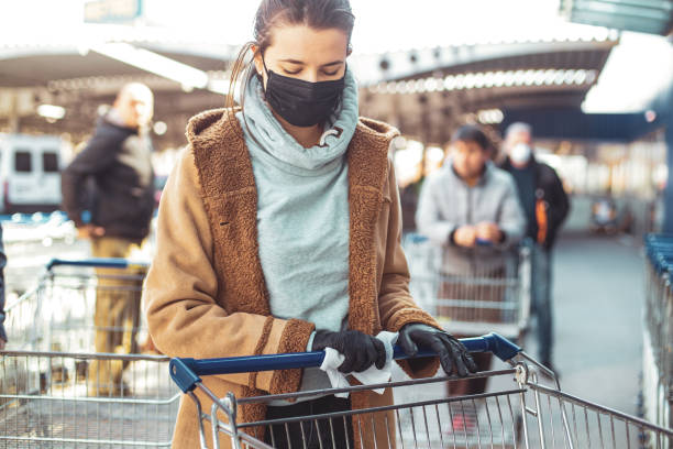 Disinfecting groceries during COVID-19 Disinfecting groceries during COVID-19 convenience store stock pictures, royalty-free photos & images