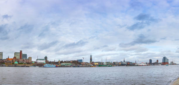 istock Panoramic cityscape view from Steinwerder viewpoint to the Elbe River, Elbphilharmonie, harbor, and waterfront in Hamburg, Germany. 1216999103