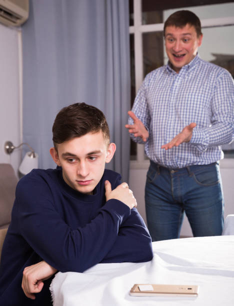 istock Father is wanting talking with his adult son after conflict 1217000802