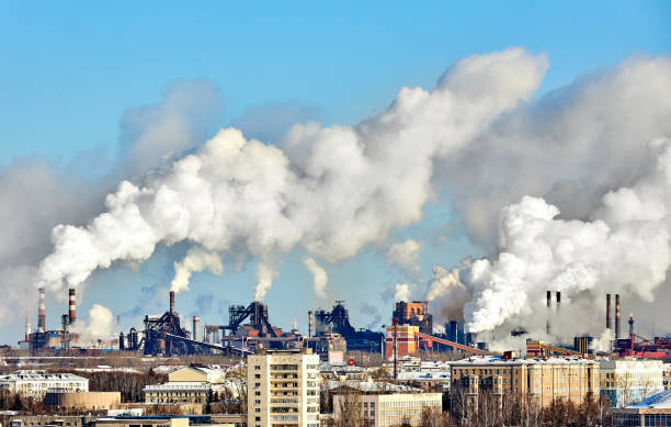 istock Poor environment in the city. Environmental disaster. Harmful emissions into the environment. Smoke and smog. Pollution of atmosphere by plant factory. Exhaust gases. 1217003245
