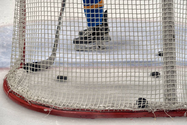 istock hockey sport, game on ice., coaching the goalkeeper. 1217003328
