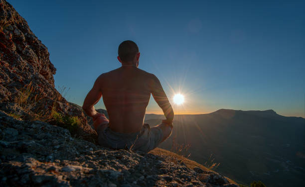 istock traveler meditate on mountain 1217003634