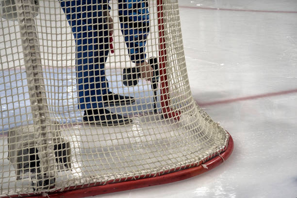 istock hockey sport, game on ice., coaching the goalkeeper. 1217005761