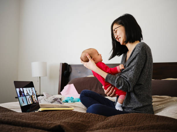 istock Woman Working Mother at Home on a Web Chat Meeting 1217005959