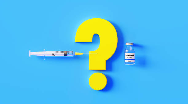COVID-19 Vaccine Bottle Question Mark and Syringe on Blue Background COVID-19 vaccine bottle, yellow question mark and syringe on blue background, Horizontal composition with copy space. COVID-19 vaccine concept. glass medicine blue bottle stock pictures, royalty-free photos & images