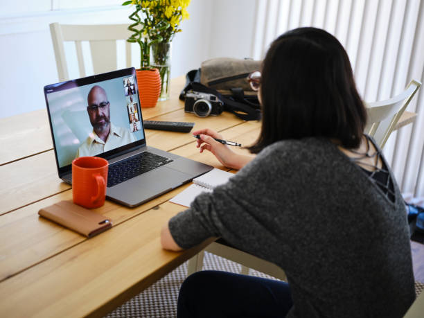 istock Woman Working at Home on a Web Chat Meeting 1217006328