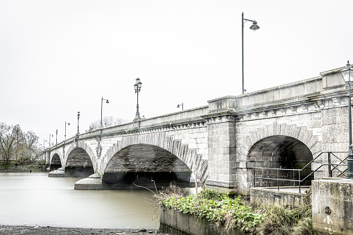 Kew bridge at the foggy morning, London, UK