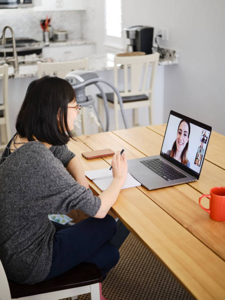 istock Woman Working Mother at Home on a Web Chat Meeting 1217006570